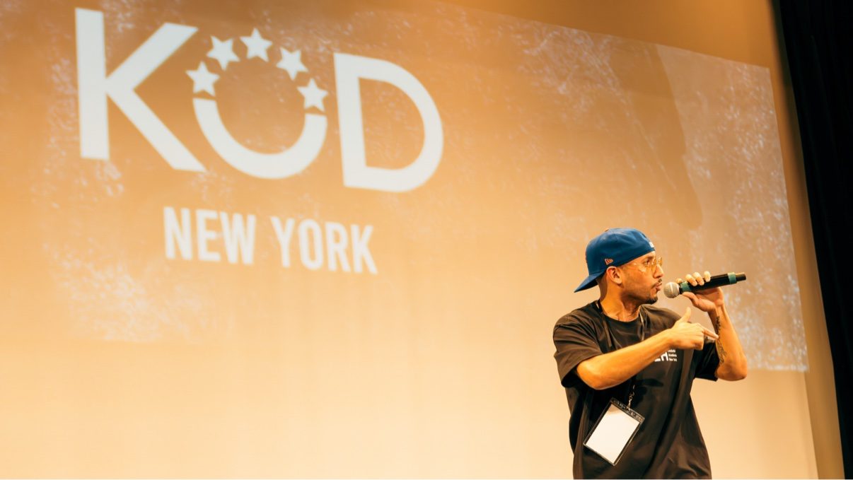 MC on stage, KOD backdrop